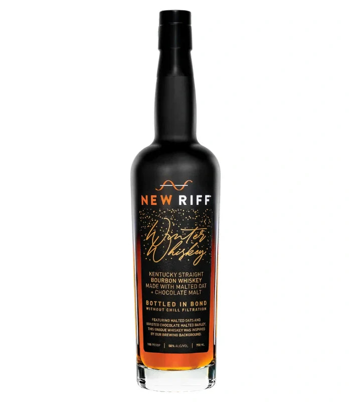 A 750mL dark glass bottle of New Riff Winter Whiskey Bottled in Bond from New Riff Distilling, a limited annual Kentucky Straight Bourbon with malted oat and chocolate malt, bottled at 100 proof with a gold and white label.
