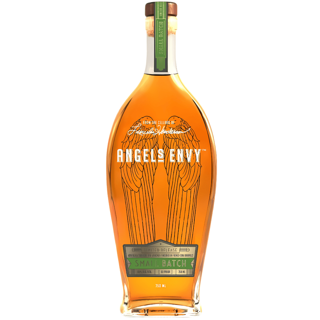 A tall, clear bottle of Angel's Envy Unique & Rare Rye Whiskey Finished In French Oak Barrels features etched angel wings, a green “Small Batch” label, brown cap with green seal, and rich amber Kentucky straight rye whiskey inside.