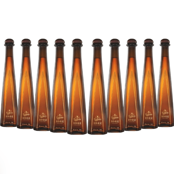 Ten miniature Don Julio 1942 Tequila Añejo 50ml Ornament bottles from Don Julio Tequila are displayed in a festive row, ideal as a luxurious holiday gift. The gold-labeled miniatures are arranged against a crisp white background.