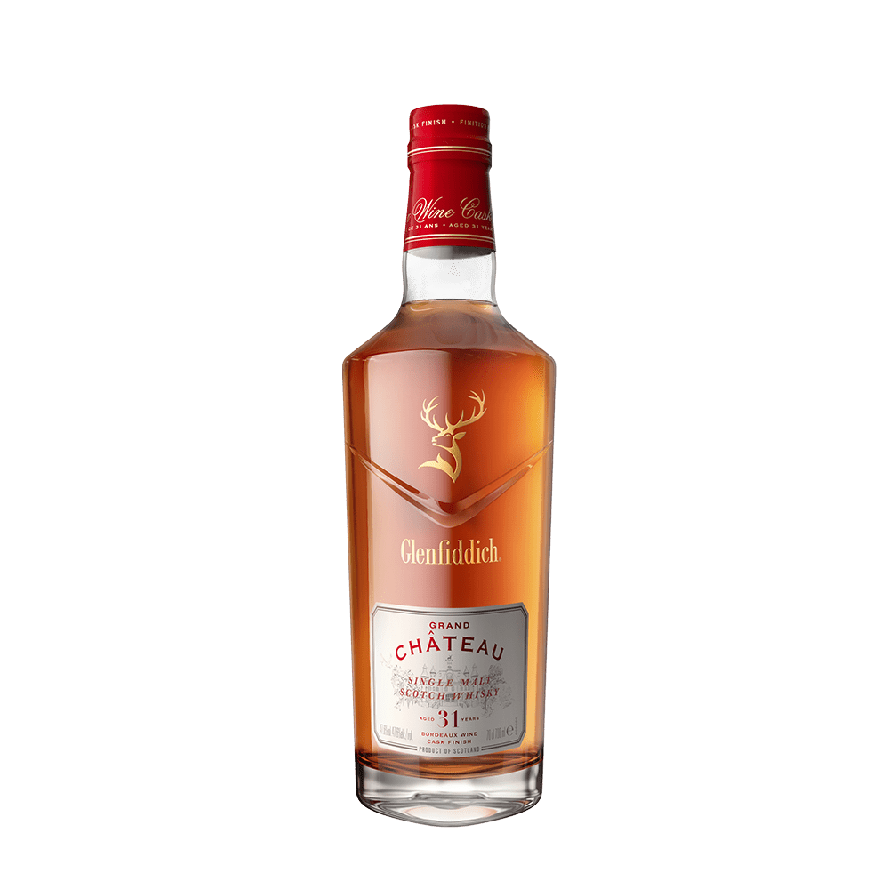 A bottle of Glenfiddich 31 Year Old Grand Chateau Bordeaux Wine Cask Finish single malt Scotch, featuring a red cap, gold stag logo, and clear label with red and gold accents, displayed on a plain white background.