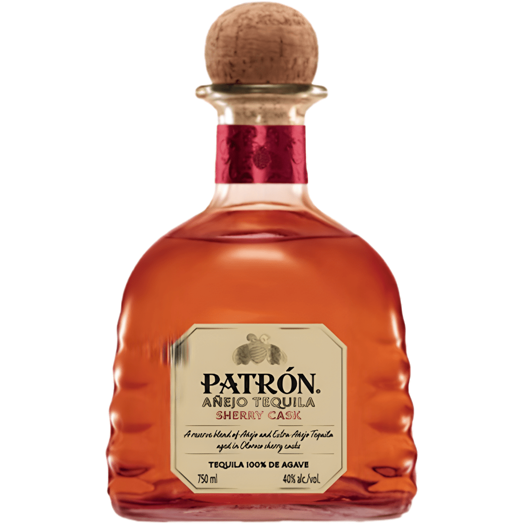 A clear, curvy bottle of Patron Sherry Cask Anejo Tequila features an amber spirit inside, topped with a wooden cork stopper, gold label, and red neck—highlighting Patron's limited-production tequila.