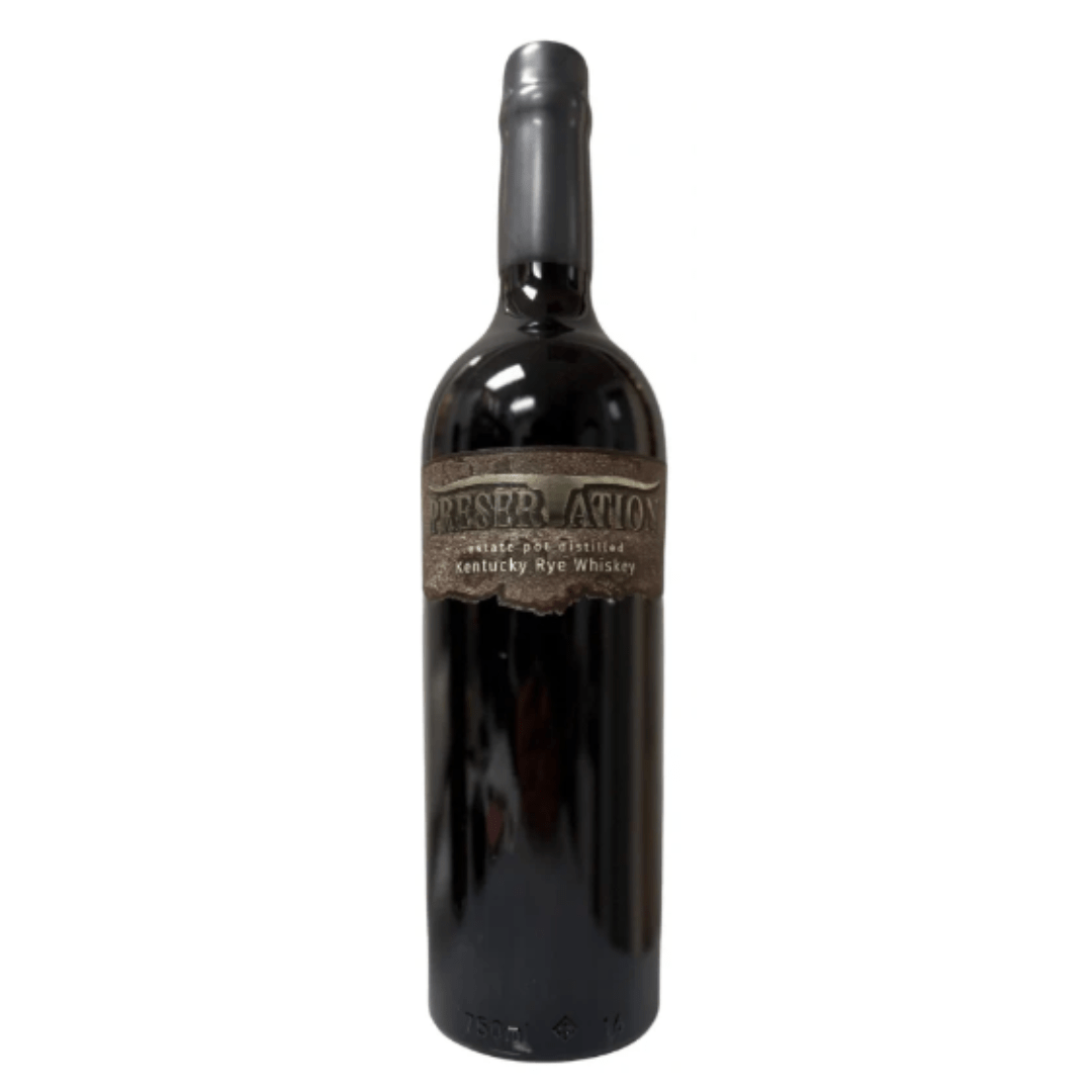 A 750mL dark glass bottle of Preservation Estate Pot Distilled Kentucky Rye Whiskey stands upright, featuring a wax-sealed top and rustic brown label by Preservation, set against a plain white background.