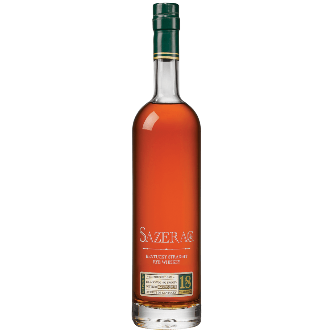 A tall bottle of Sazerac Rye 18 Year Old Kentucky Rye Whiskey 2025 Release, filled with amber liquid. The green and gold label highlights the Sazerac brand and its place in the Buffalo Trace Antique Collection after 18 years aging.