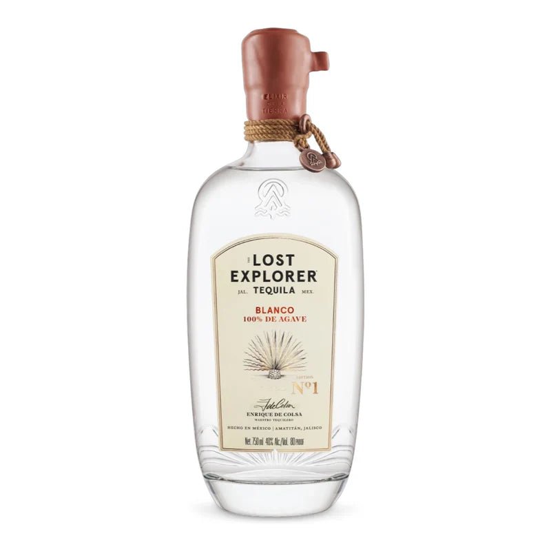 A clear bottle of The Lost Explorer Blanco Tequila by The Lost Explorer, made from sustainably grown agave, has a beige label with an embossed agave design and a copper wax seal on the cap, displayed on a white background.