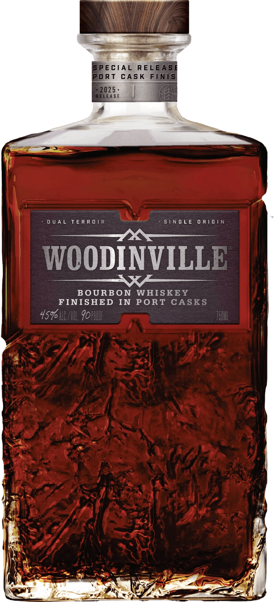 A bottle of Woodinville Port Finished Straight Bourbon, a straight bourbon whiskey from Woodinville, finished in ruby port casks. The label reads Special Release and indicates 45% ALC/VOL (90 PROOF), while the glass features a textured pattern on its lower portion.