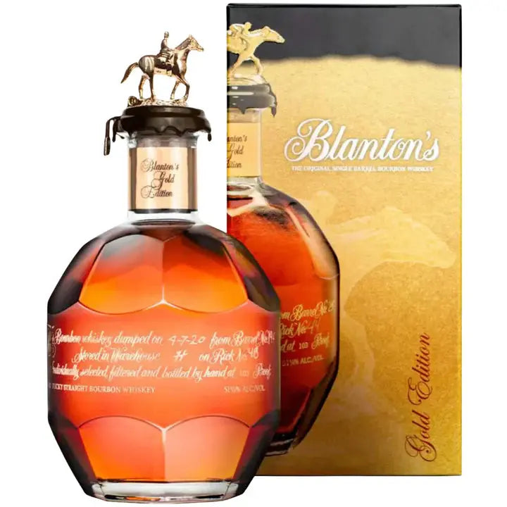A 700ml bottle of Blanton's Gold Edition Bourbon is shown with its signature horse and jockey cap, in front of a gold and brown box. The etched Blanton's Bourbon bottle holds rich amber liquid.