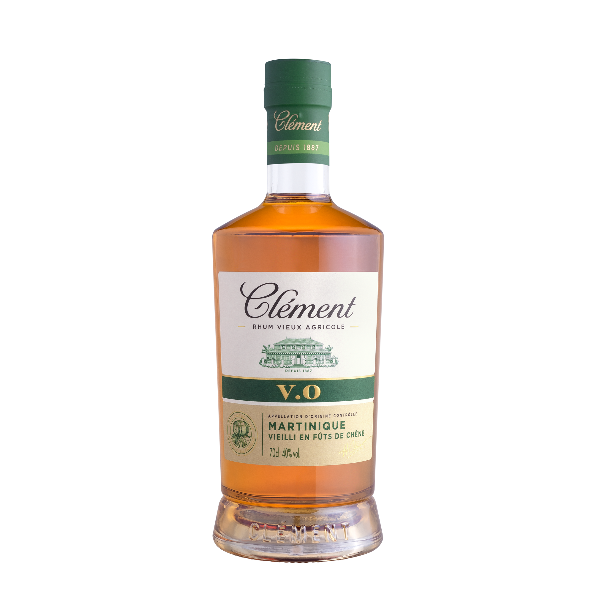 A bottle of Rhum Clément V.O from Martinique with a green cap, amber liquid, and a white label—crafted from sugarcane juice for an authentic Martinique rum experience.