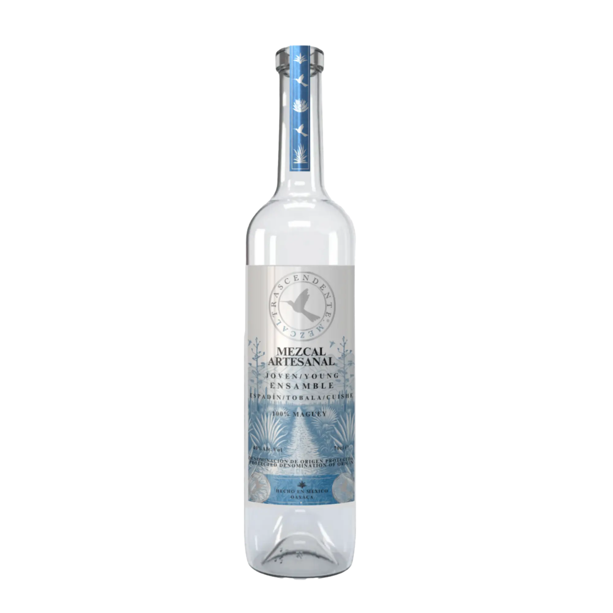 A clear glass bottle of Mezcal Trascendente Ensamble 700ml, with a light blue and silver label featuring agave designs and the Mezcal Trascendente logo, displayed against a plain white background.