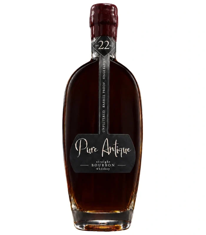 A dark brown bottle of Pure Antique 22 Year Old Straight Bourbon Whiskey, single barrel with a wax-sealed top and a label reading Unfiltered Barrel Proof Small Batch No. 22 from Pure Antique.