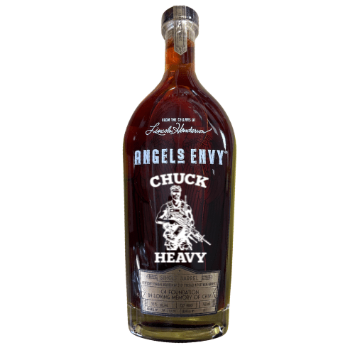 A specially etched Angel's Envy Chuck Heavy C4 Foundation bourbon bottle featuring a custom “CHUCK HEAVY” label, soldier illustration, and tribute text honoring a fallen hero; designed with the C4 Foundation.