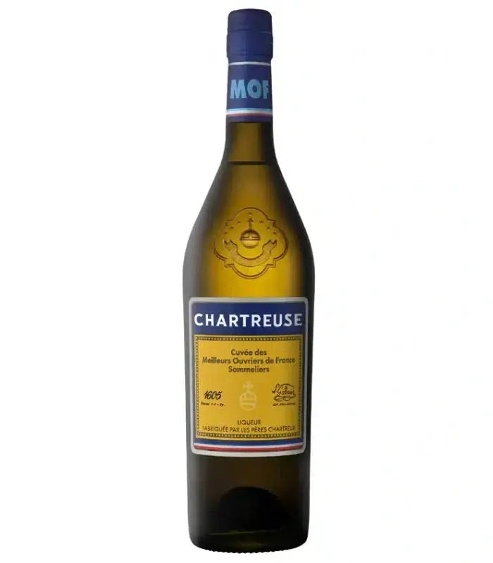 A brown bottle of Chartreuse Cuvee des MOF Liqueur from Chartreuse, a renowned French herbal liqueur, with a blue and yellow label reading "Cuvée des Meilleurs Ouvriers de France Sommeliers." The bottle features a blue cap and gold accents on the label, making it an elegant addition to any craft cocktail collection.