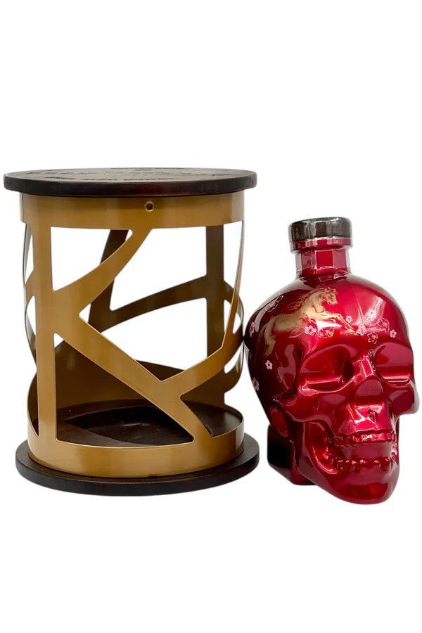 A striking red Crystal Head Vodka Year of the Horse 2026 Lunar New Year Limited Edition skull bottle with a silver cap is paired with a gold and black lantern-style display—perfect for collectors and fans of unique spirits.