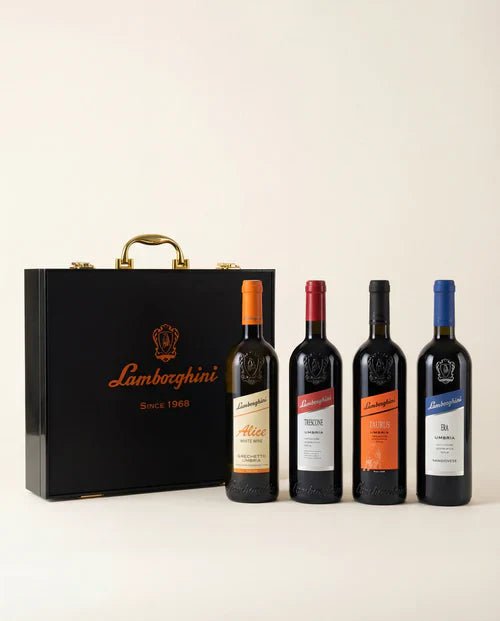 The Lamborghini Ultimate Wine Gift Set—Trescone, Era, Taurus, and Alice—by Lamborghini Wine & Spirits Collections features four labeled bottles and a luxury black gift case with gold accents, perfect for any elegant wine gifting occasion.