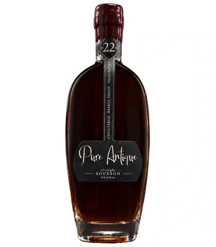 A dark brown bottle of Pure Antique 22 Year Old Straight Bourbon Whiskey, single barrel with a wax-sealed top and a label reading Unfiltered Barrel Proof Small Batch No. 22 from Pure Antique.