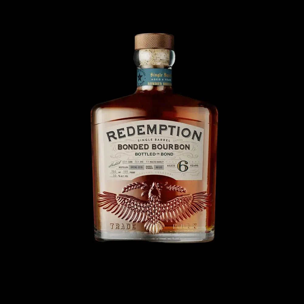 A bottle of Redemption Single Barrel Bottled in Bond Bourbon 6 Year by Redemption, showcasing a decorative eagle design and labeled as a high-rye, 6-year-old Bottled in Bond bourbon, stands out against a striking black background.