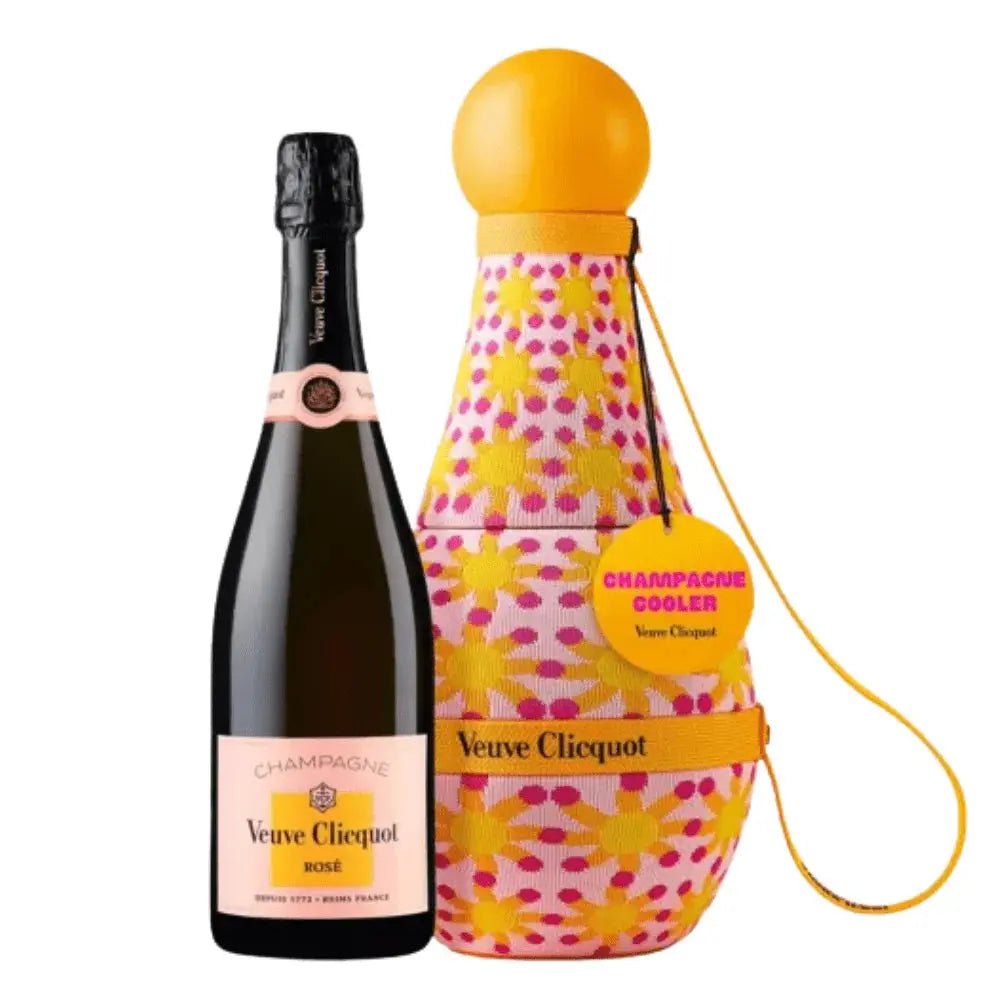 A bottle of Veuve Clicquot Brut Rosé sits alongside the vibrant yellow and pink floral-patterned Yinka Ilori Sun Totem Cooler—shaped like a champagne bottle, featuring a yellow carry strap and a “CHAMPAGNE COOLER Veuve Clicquot” tag. This unique set, the Veuve Clicquot Brut Rose Yinka Ilori Sun Totem Cooler Gift Box, is the perfect Champagne gift for any celebration.