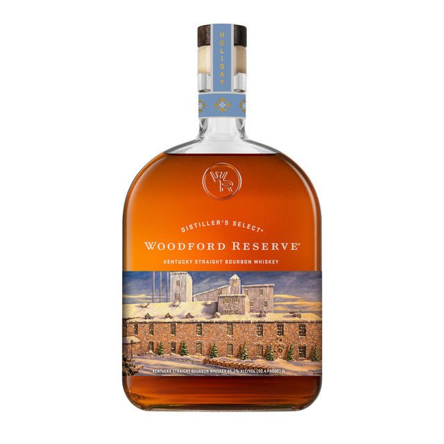 A bottle of Woodford Reserve Bourbon Holiday Edition 2026 750ml, featuring a winter-themed label with a distillery scene and snowflakes on the neck.