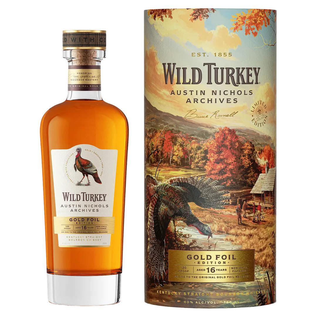 A bottle of Wild Turkey Austin Nichols Archives Gold Foil Edition 16 Year Old Bourbon stands beside its vibrant box, featuring a wild turkey and autumn scenery, highlighting this limited edition release from Wild Turkey.
