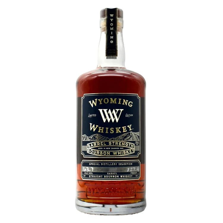 A bottle of Wyoming Whiskey Barrel Strength Limited Edition Aged in New Charred Oak 127.4 Proof features detailed branding, a black and gold label, amber whiskey, and a matching cap.
